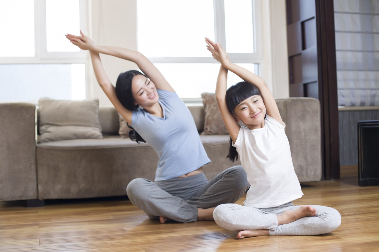 young-mother-and-daughter-doing-yoga-at-home-2022-03-31-23-09-09-utc-2